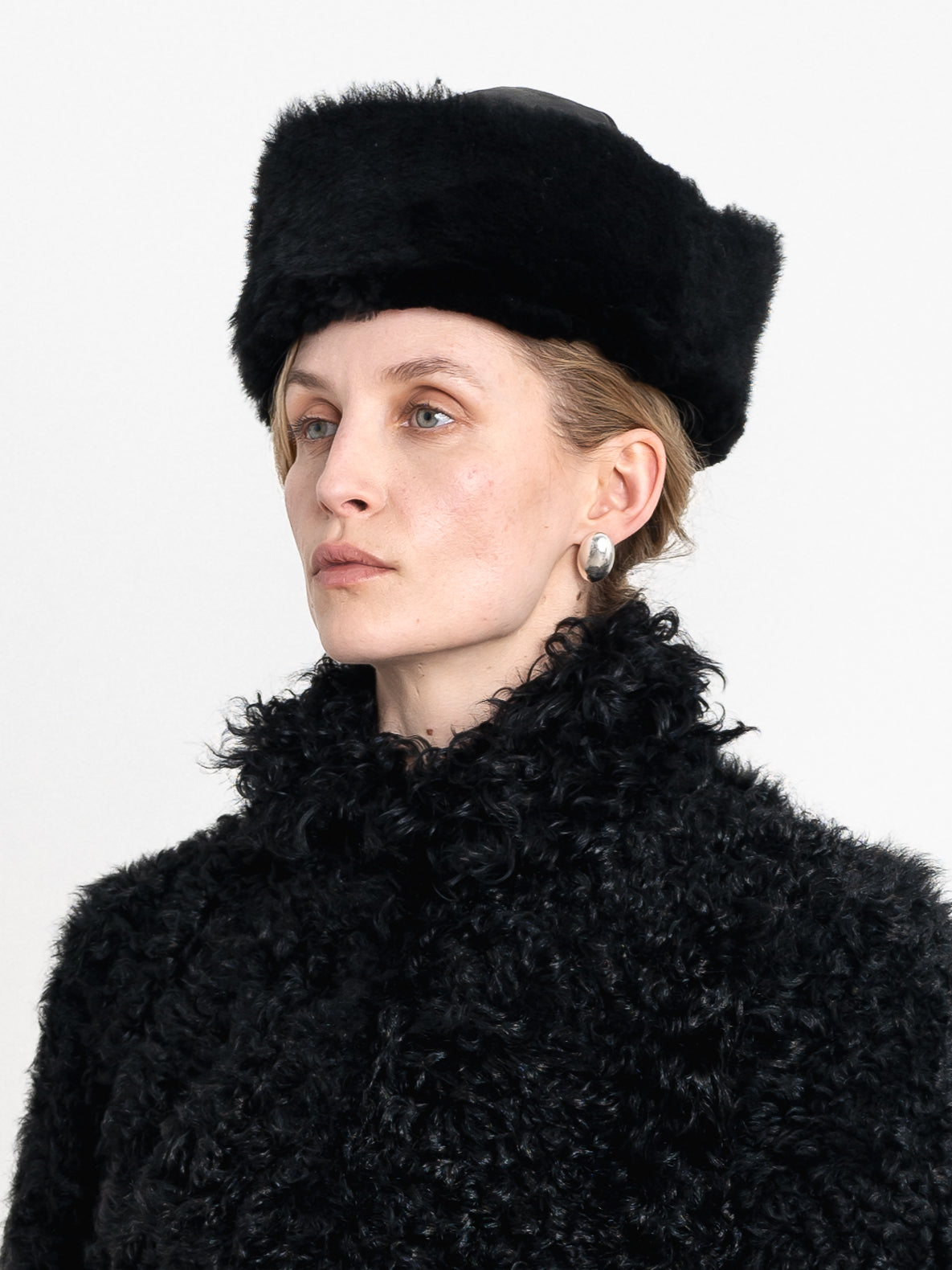 Suede Back Curly Sheepskin Cap in Black